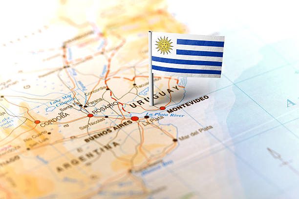 Uruguay pinned on the map with flag The flag of Uruguay pinned on the map. Horizontal orientation. Macro photography. uruguay stock pictures, royalty-free photos & images
