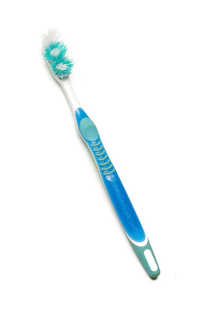 Used toothbrush isolated on the white background stock photo
