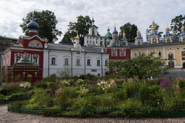 Uspenskaya square with Sacristy, belfry, Uspensky (Assumption) cathedral in the Pskov-Caves Holy Dormition Monastery. Pechory, Russia Pechory, Russia - 22 august, 2020: Uspenskaya square with Sacristy, belfry, Uspensky (Assumption) cathedral in the Pskov-Caves Holy Dormition Monastery. Pechory, Russia pskov russia stock pictures, royalty-free photos & images