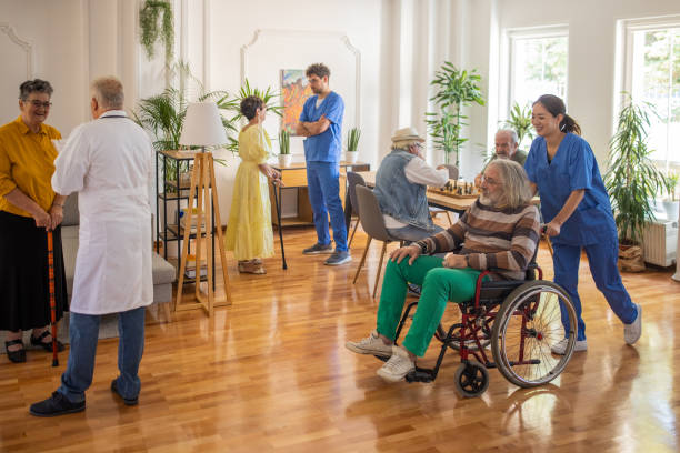 Usual day in crowded nursing home stock photo