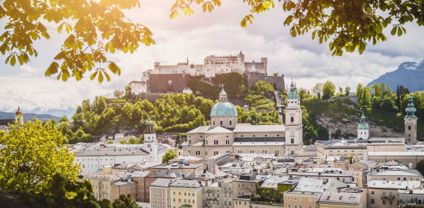 Vacation in Salzburg: Salzburg old city with fortress and cathedral in spring, Austria stock photo