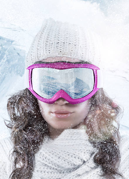 Vacation. The snowy mountains in the Ski Goggles stock photo