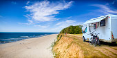 istock Vacations in Poland - motorhome over a cliff on the Baltic Sea 1298980143