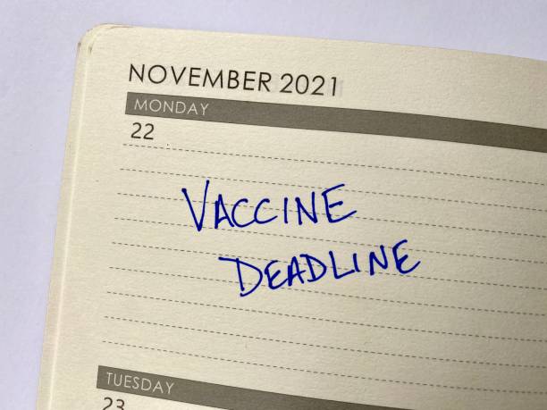 Vaccine deadline on calendar COVID Vaccine deadline marked on a calendar. November 22, 2021 is the deadline for federal employees. vaccine mandate stock pictures, royalty-free photos & images