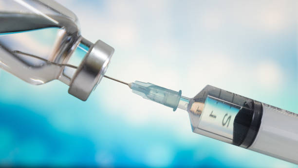 Vaccine medicine bottle and syringe injection use for prevention and treatment of virus infection disease.Medical personnel are preparing vaccines for medical treatment. stock photo
