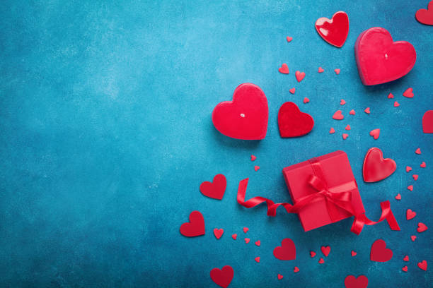 Valentines day background with gift box and red hearts. Top view. Flat lay style. Valentines day background with gift box and red hearts. Top view. Flat lay style. Copy space for greeting text. february stock pictures, royalty-free photos & images