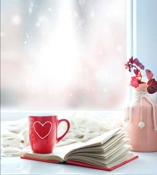 Valentine's day background,red mug on window still. Valentine's day background.Red mug with heart on window still empty copy space backdrop. february stock pictures, royalty-free photos & images