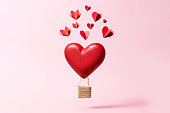 istock Valentine's day or Women's day and love concept background. Red heart shaped balloon on pink backdrop. Banner for greeting card or sale 1363578645