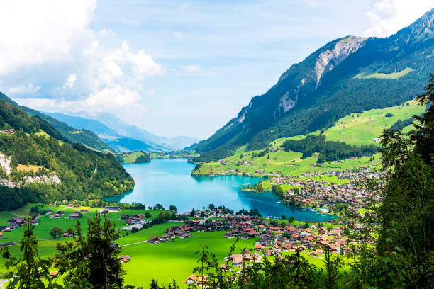Valley of Lake Lungern or Lungerersee in Obwalden, Switzerland Valley of Lake Lungern or Lungerersee in Obwalden, Switzerland. lungern village switzerland lake stock pictures, royalty-free photos & images