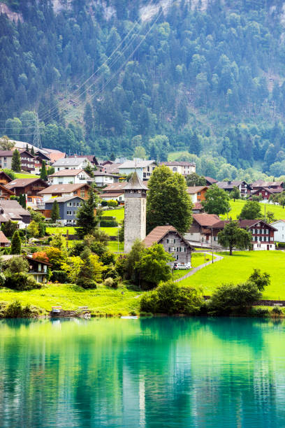 Valley of Lake Lungern or Lungerersee in Obwalden, Switzerland Valley of Lake Lungern or Lungerersee in Obwalden, Switzerland. lungern village switzerland lake stock pictures, royalty-free photos & images