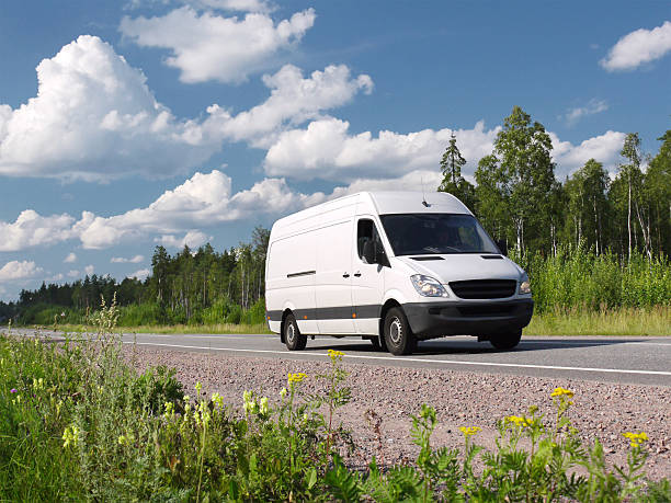 van on country highway  mini van stock pictures, royalty-free photos & images