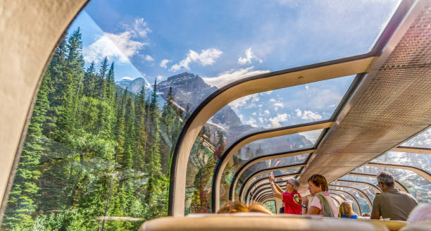Vancouver, British Columbia / Canada - 06/17/2015 Rocky Mountaineer train traveling through the Rocky Mountains with luxury dining on board. stock photo