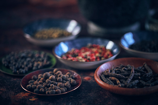 Variation of Spices Chili Powder, Peppercorns, Cayenne Pepper, Turmeric, Cumin, and Garlic Powder