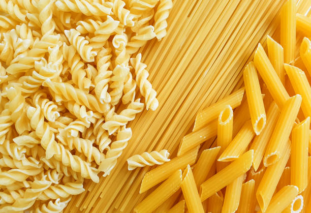 Variety of types of dry Italian pasta  uncooked pasta stock pictures, royalty-free photos & images