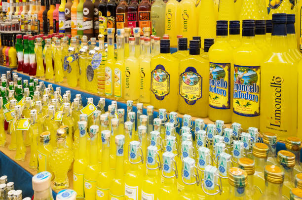 Various alcoholic beverages sold on the market. Popular Italian lemon liqueur Limoncello. stock photo
