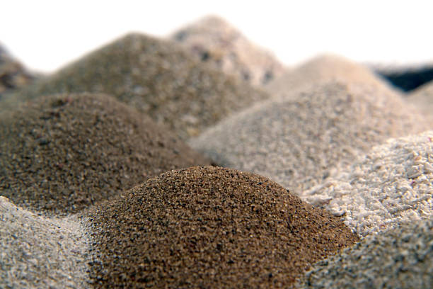 various brown sand piles stock photo