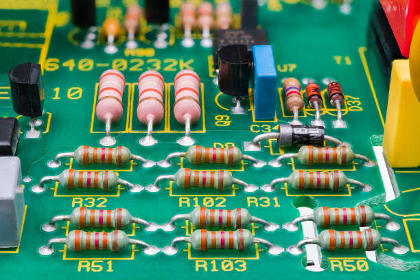 Various electronic components on detail of printed circuit board. Electrotechnics stock photo