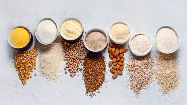Various gluten free flour Various gluten free flour - chickpeas, rice, buckwheat, quinoa, almond, corn, oatmeal on grey background. pea protein powder stock pictures, royalty-free photos & images