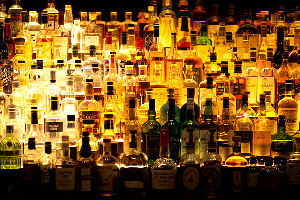 Various Liquor bottles backlit. stock photo