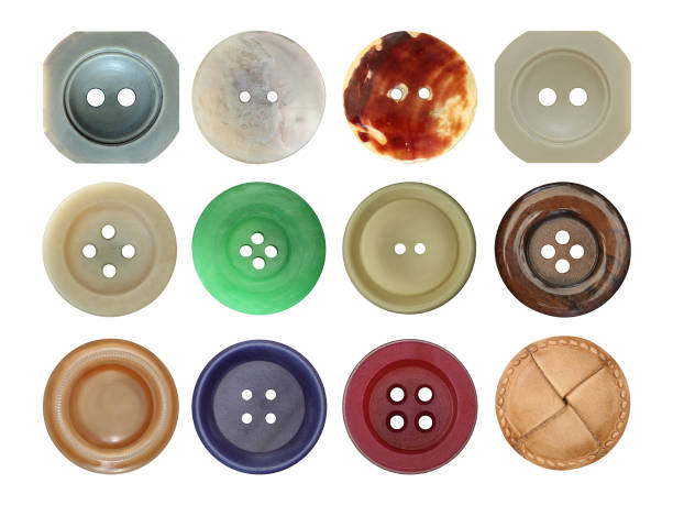 Various old and used buttons on white background stock photo