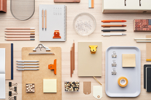 Flat lay of assorted modern supplies for education placed in order on table in workplace