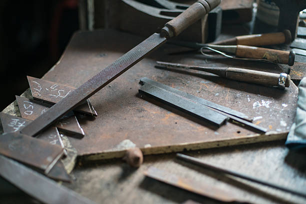 Various tools in a blacksmith and metalworking shop stock photo