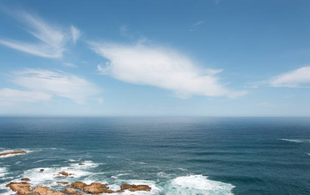 Vast ocean view with clouds in sky stock photo