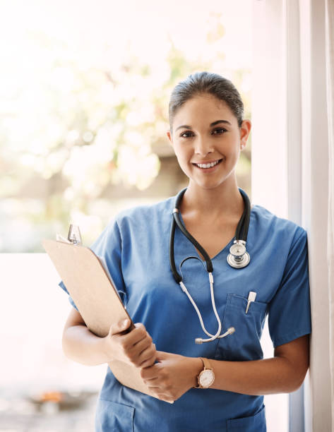 I've always got my patient records on hand Cropped portrait of an attractive young female medical practitioner holding a clipboard in a hospital female nurse stock pictures, royalty-free photos & images