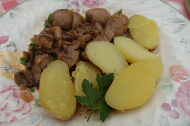 Veal kidney cooked with a Madeira sauce served with Steamed potatoes  French cooking stock photo