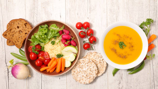 vegan meal with vegetable salad and soup stock photo