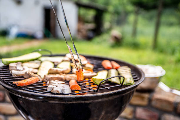 Vegan open fire barbecue with zucchini, carrots and mushrooms stock photo