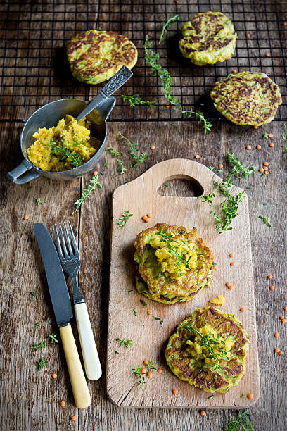 Vegan zucchini burgers with red lentil paste stock photo