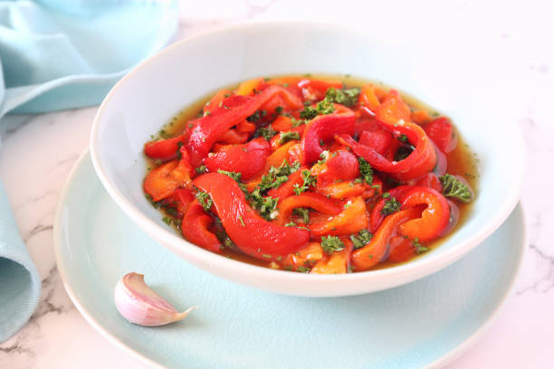 Vegetable salad: roasted bell pepper, parsley and garlic stock photo