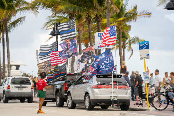 Vehicles on Fort Lauderdale Beach with President Trump support flags Fort Lauderdale, FL, USA - November  22, 2020: Vehicles on Fort Lauderdale Beach with President Trump support flags donald trump stock pictures, royalty-free photos & images