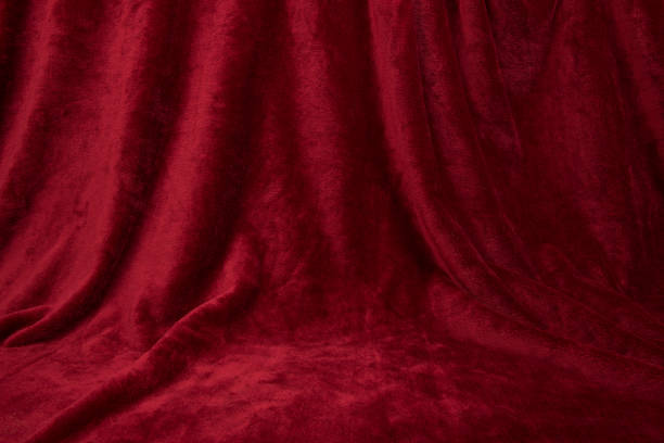 Velvet red drapped curtain cloth full frame stock photo