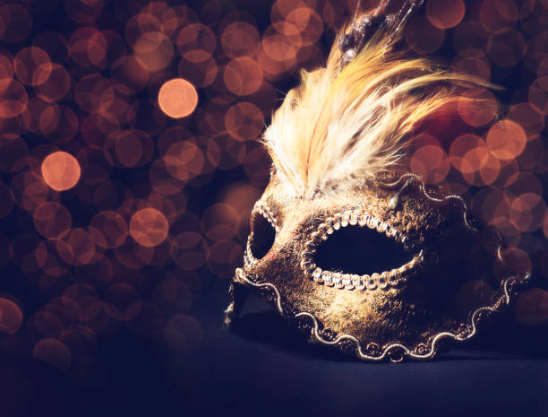 Venetian mask Golden venetian mask over black background costume stock pictures, royalty-free photos & images