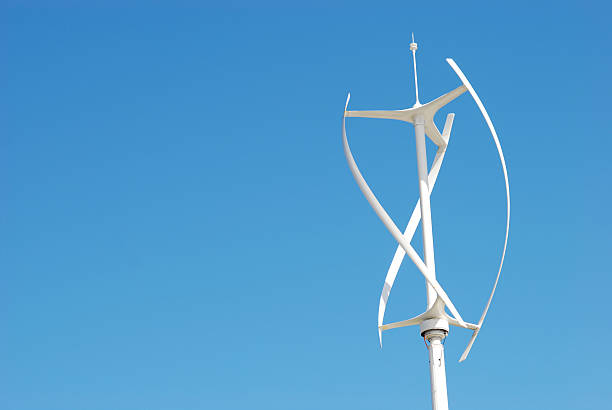 Vertical axis energy wind turbines Vertical axis energy wind turbines - Copy space - Blue sky  vertical axis wind turbine stock pictures, royalty-free photos & images