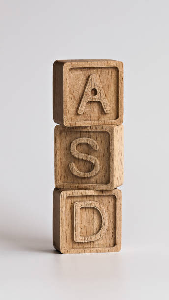 vertical photo on ASD (autism spectrum disorders) theme. wooden cubes with the abbreviation "ASD", on white background stock photo