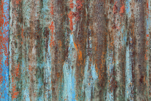 Vertical wavy pattern on corrugated metal sheet texture Vertical wavy pattern on corrugated metal sheet texture. rusty fence stock pictures, royalty-free photos & images