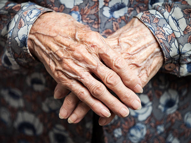 Very old woman hands stock photo