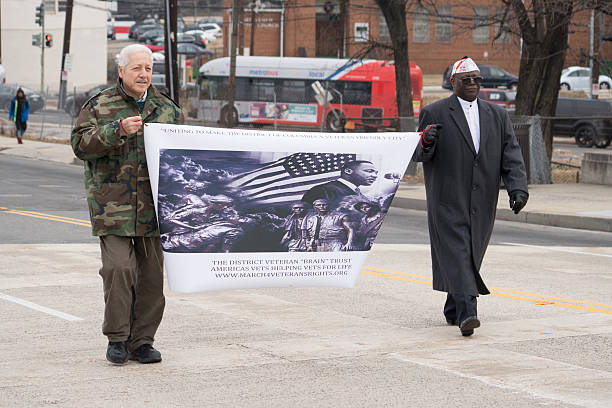 Veterans Commemorate Dr. Martin Luther King, Jr. Washington, DC - January 16, 2017: Veterans march in the annual Martin Luther King, Jr. Day Peace Walk and Parade. martin luther king jr day stock pictures, royalty-free photos & images