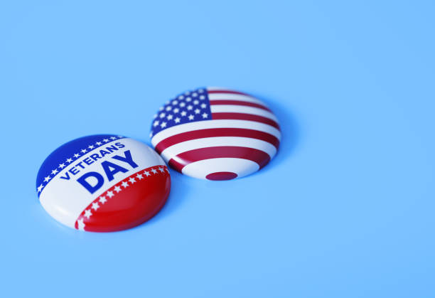 Veterans Day Written Badge Pair Sitting on Blue Background Veterans Day written badges sitting on blue background. Horizontal composition with copy space. Veterans Day concept. memorial day background stock pictures, royalty-free photos & images