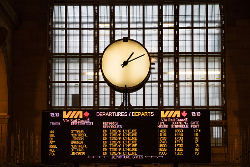 TORONTO, ONTARIO, CANADA - January 9, 2016: Via Rail clock at Union Station with departure board