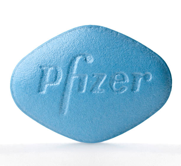 Viagra pill "Miami, USA - March 24, 2012: Viagra pill. Viagra is distributed by the pharmaceutical company Pfizer." anti impotence tablet stock pictures, royalty-free photos & images