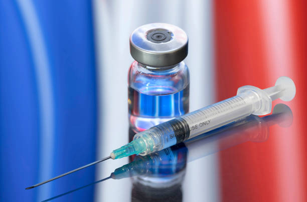 Vial ampoule vaccine for Corona Virus Covid-19 with Flag of France stock photo