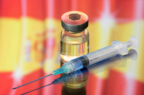 Vial ampoule vaccine for Corona Virus Covid-19 with Flag of Spain stock photo