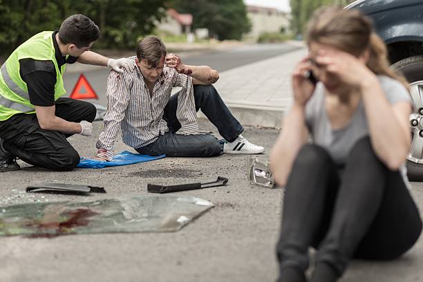 Victims of car accident People sitting on the road after car crash victim stock pictures, royalty-free photos & images