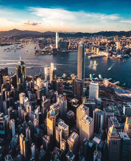 Victoria harbour of Hong Kong at sunset. stock photo