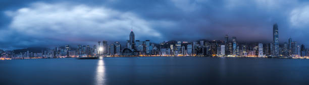 Victoria Harbour under cloud at dawn in Hong Kong stock photo