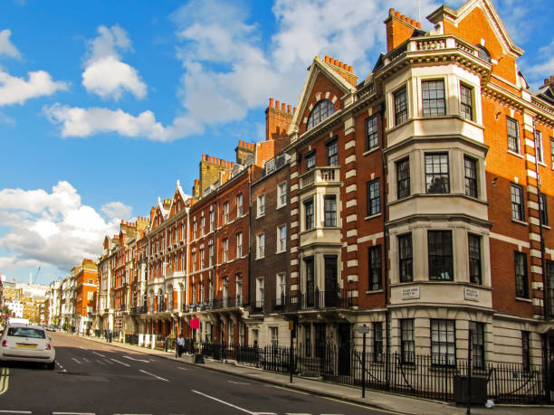 Victorian Buildings of Marylebone Red brick Victorian Buildings along Queen Anne"u2019s Street in Marylebone, London, UK on a clear summers day central london stock pictures, royalty-free photos & images